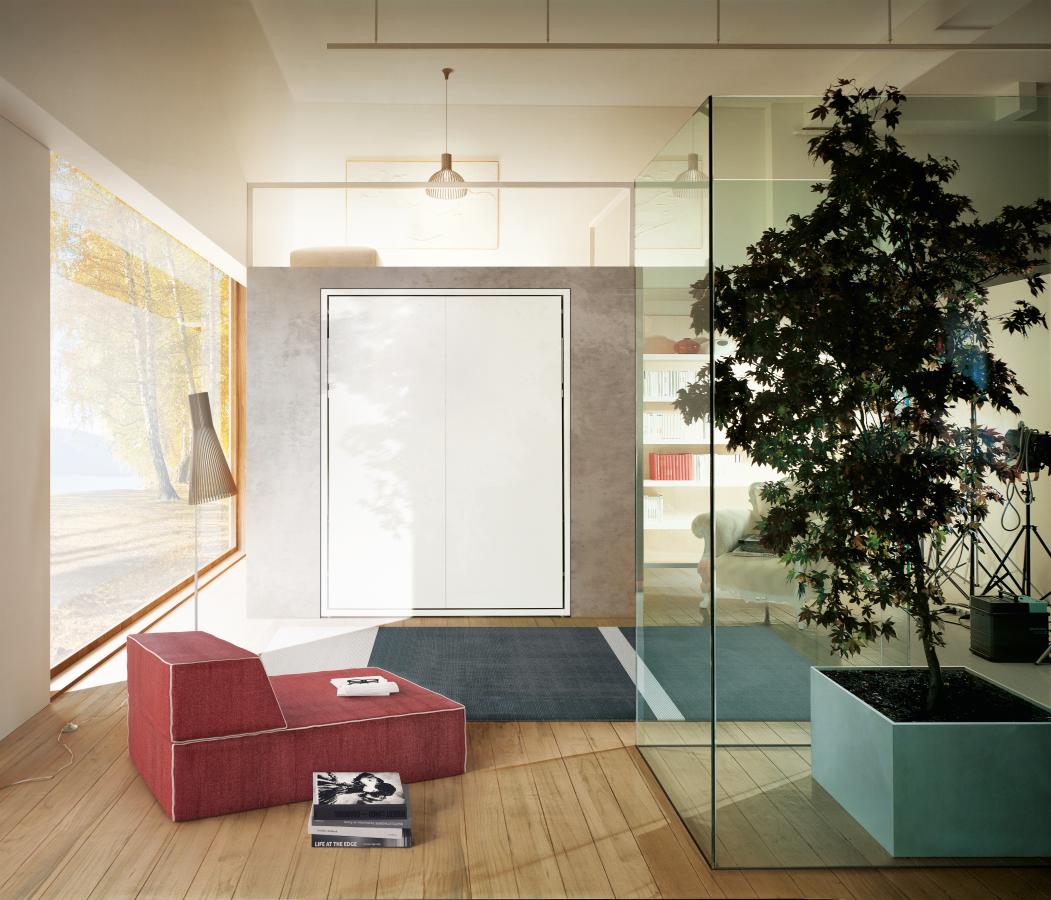 Letto matrimoniale a scomparsa Penelope 2 Standard Clei chiuso su parete in ambiente moderno luminoso.